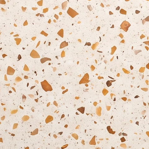 Muestra de porcelanato efecto terrazo, blanco con granos ámbar